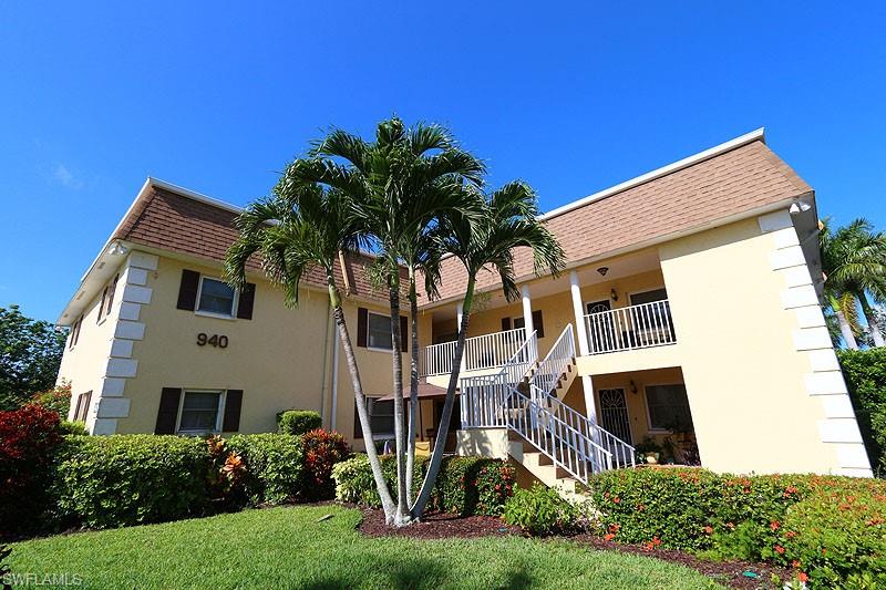 940 3rd Street South, Unit 101 Naples, FL 34102 - Photo 3 of 20 View of building exterior with stairs