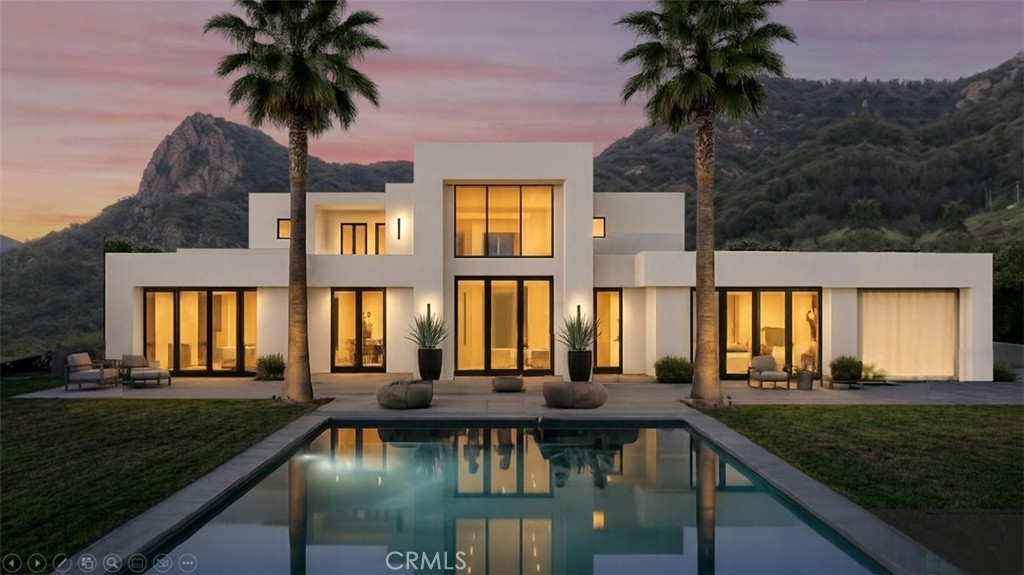 32067 Lobo Canyon Road Agoura Hills, CA 91301 - Photo 1 of 13 a front view of a house with a garden view