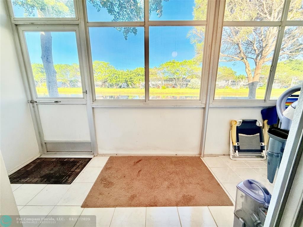 42 Tilford C, Unit 42 Deerfield Beach, FL 33442 - Photo 19 of 50 a bedroom with a bed and a window