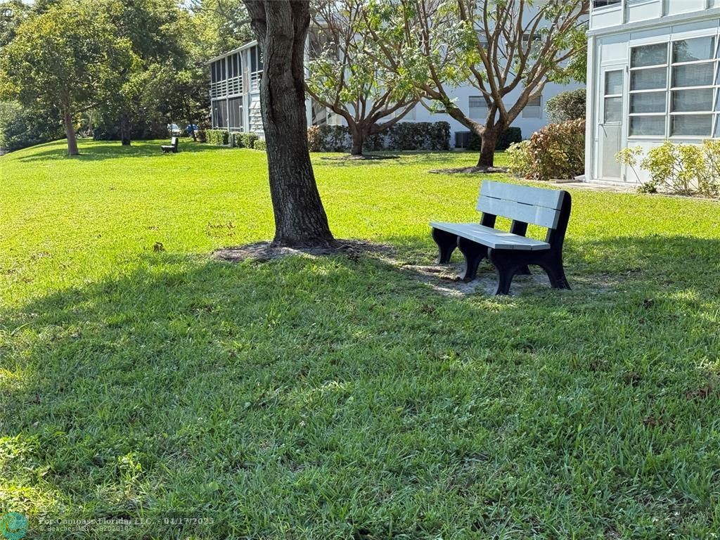 42 Tilford C, Unit 42 Deerfield Beach, FL 33442 - Photo 27 of 50 a view of a park with large trees