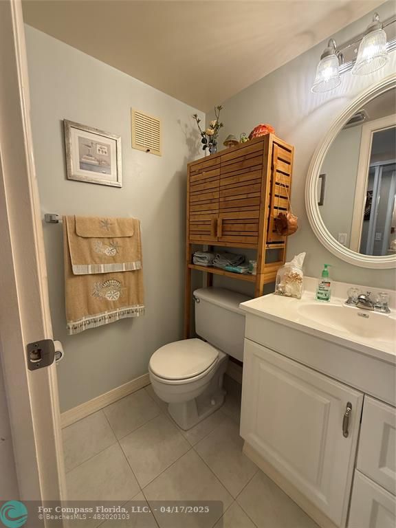 42 Tilford C, Unit 42 Deerfield Beach, FL 33442 - Photo 34 of 50 a bathroom with a sink toilet and shower