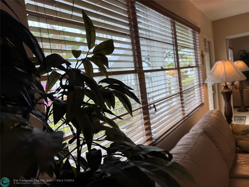 42 Tilford C, Unit 42 Deerfield Beach, FL 33442 - Photo 39 of 50 a view of a balcony with a tree