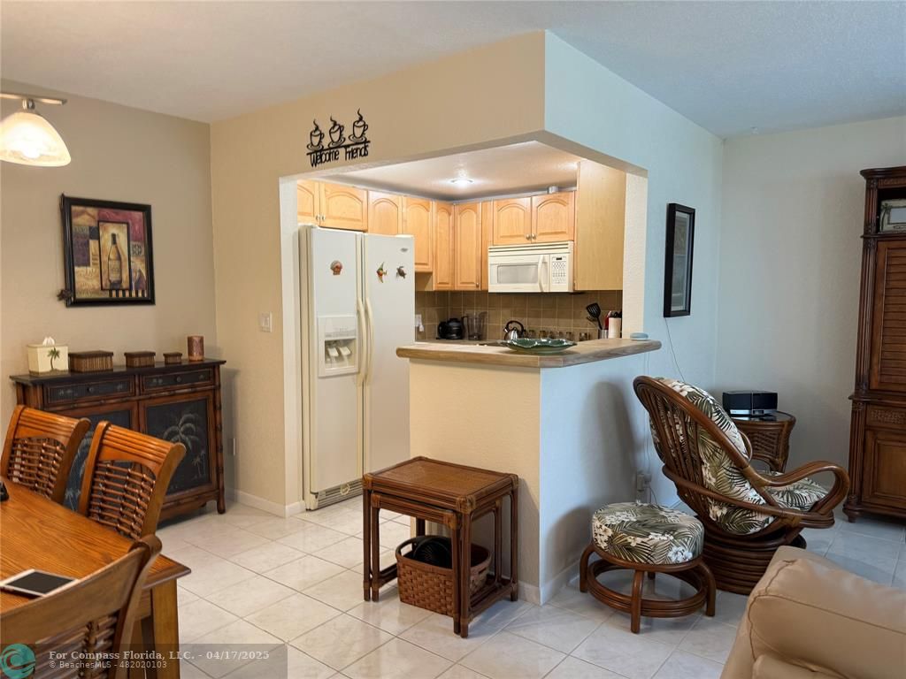 42 Tilford C, Unit 42 Deerfield Beach, FL 33442 - Photo 40 of 50 a room with furniture and a window