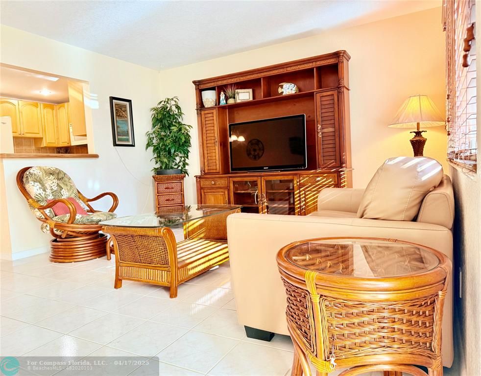 42 Tilford C, Unit 42 Deerfield Beach, FL 33442 - Photo 43 of 50 a living room with furniture and a flat screen tv