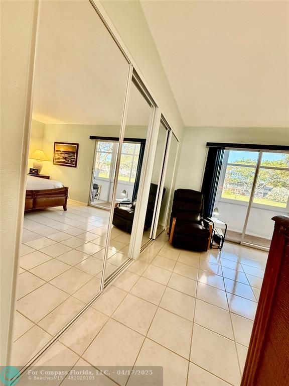 42 Tilford C, Unit 42 Deerfield Beach, FL 33442 - Photo 45 of 50 a lobby with furniture and rug