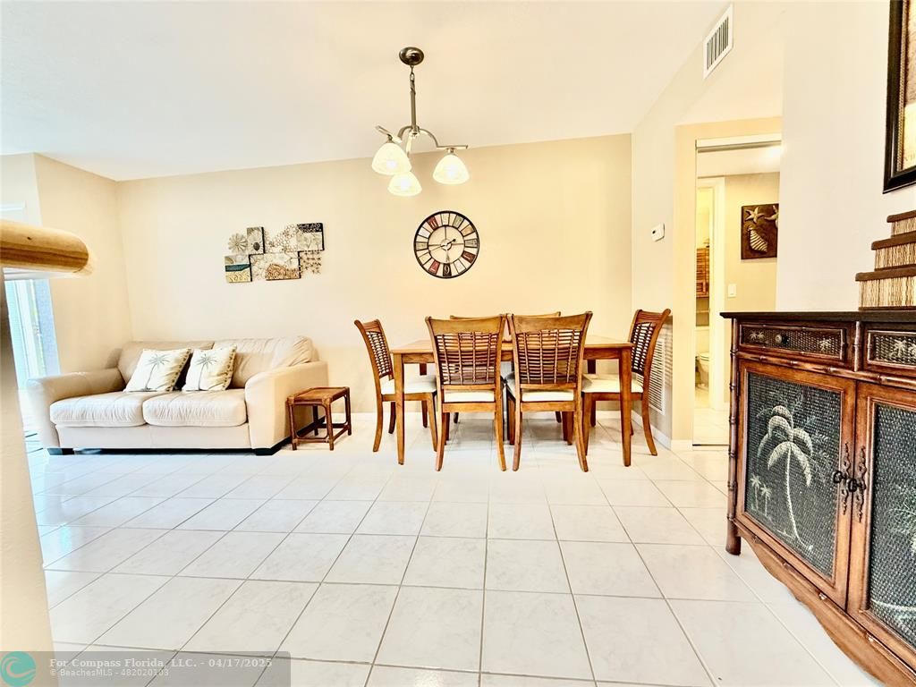 42 Tilford C, Unit 42 Deerfield Beach, FL 33442 - Photo 8 of 50 a living room with fireplace furniture and a flat screen tv