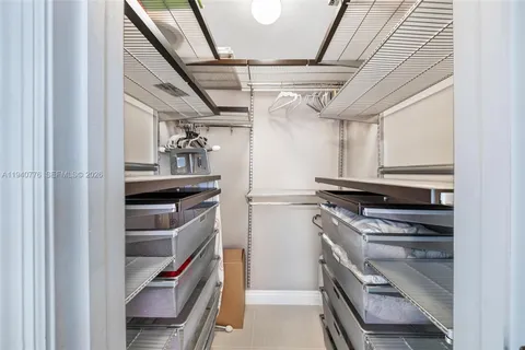 a kitchen with a refrigerator and a sink