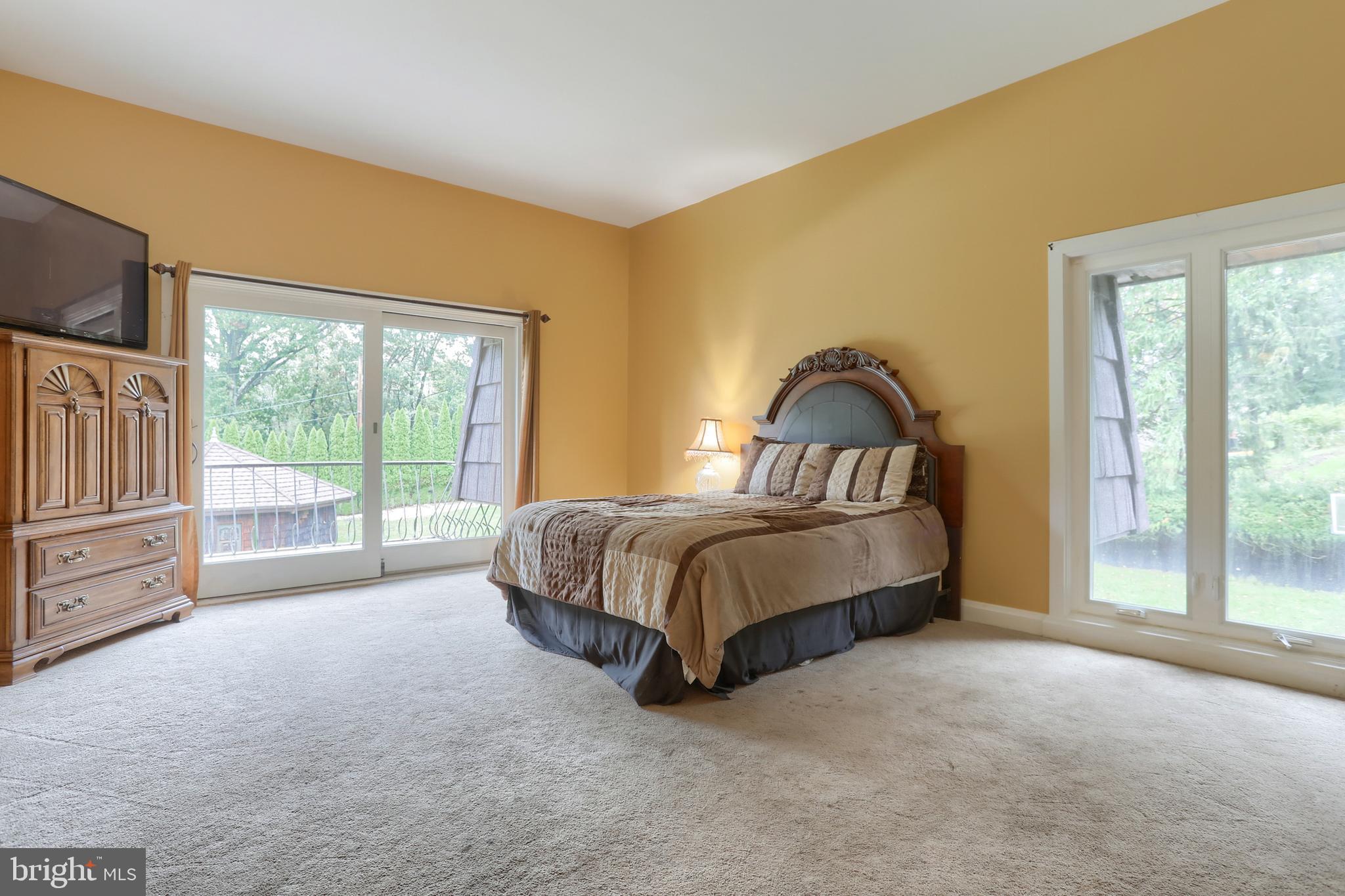 4122 Crestview Road Harrisburg, PA 17112 - Photo 20 of 71 a spacious bedroom with a bed and glass door