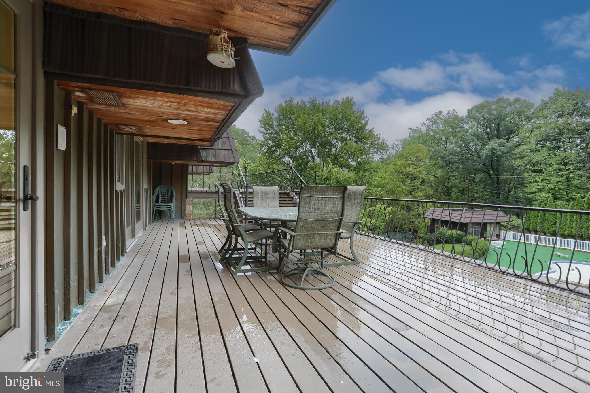 4122 Crestview Road Harrisburg, PA 17112 - Photo 66 of 71 a view of a roof deck with table and chairs with wooden floor