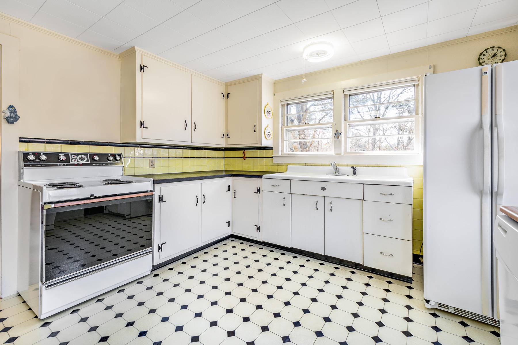 13 Atwood Road Truro, MA 02666 - Photo 15 of 36 a kitchen with a stove a sink and a window