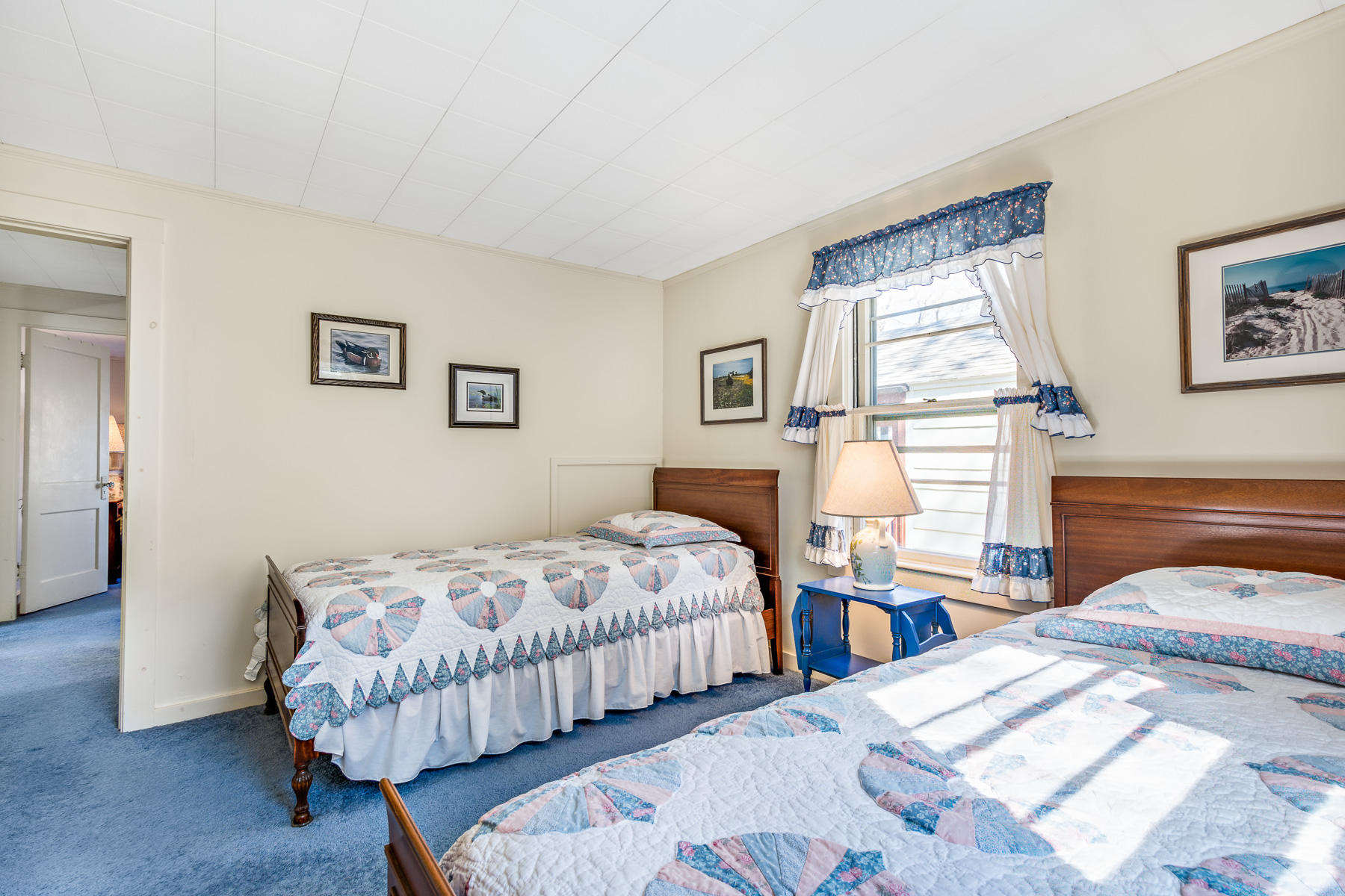 13 Atwood Road Truro, MA 02666 - Photo 24 of 36 a bedroom with two beds and painting on the wall