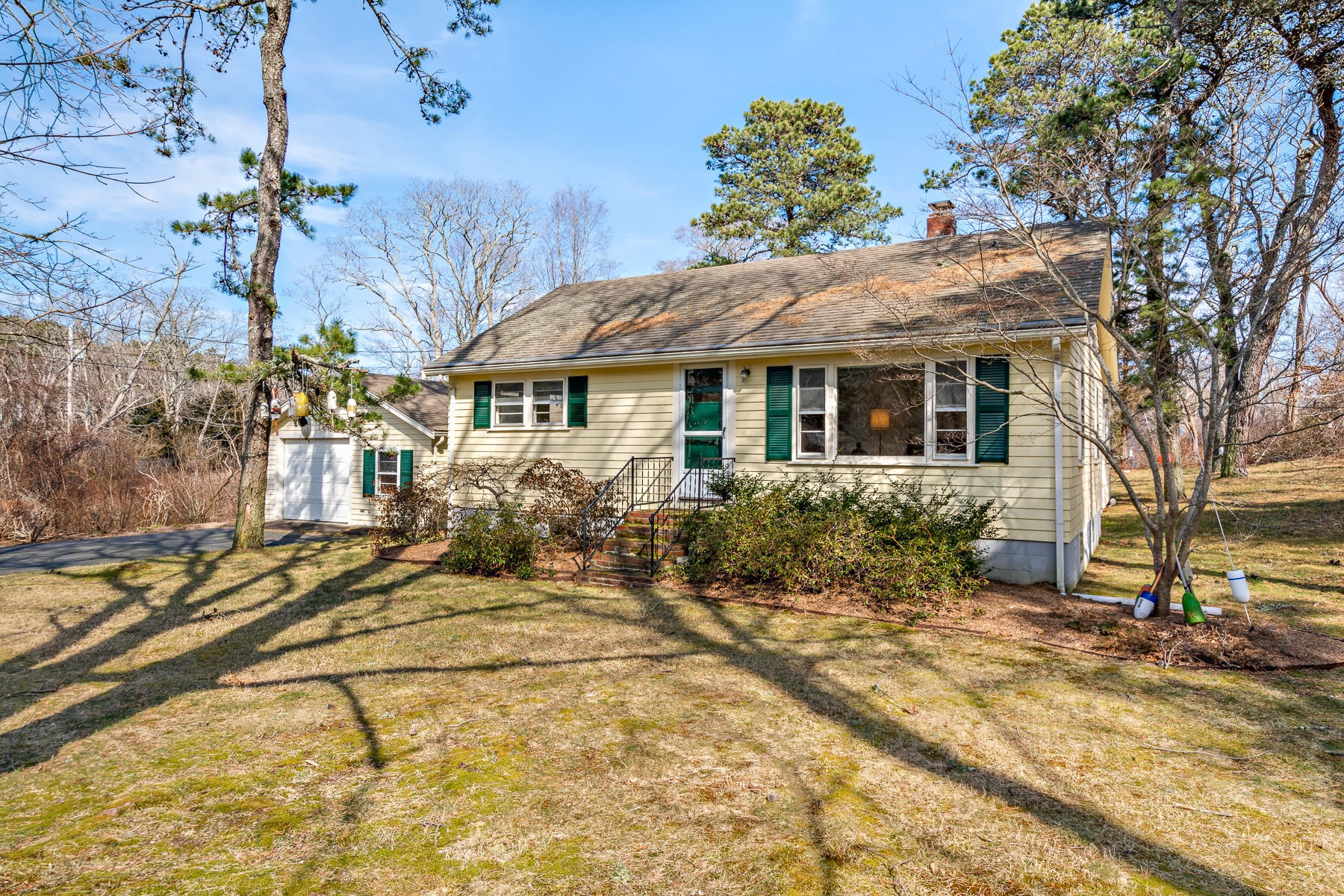 13 Atwood Road Truro, MA 02666 - Photo 3 of 36 a view of a house with a large tree and a yard