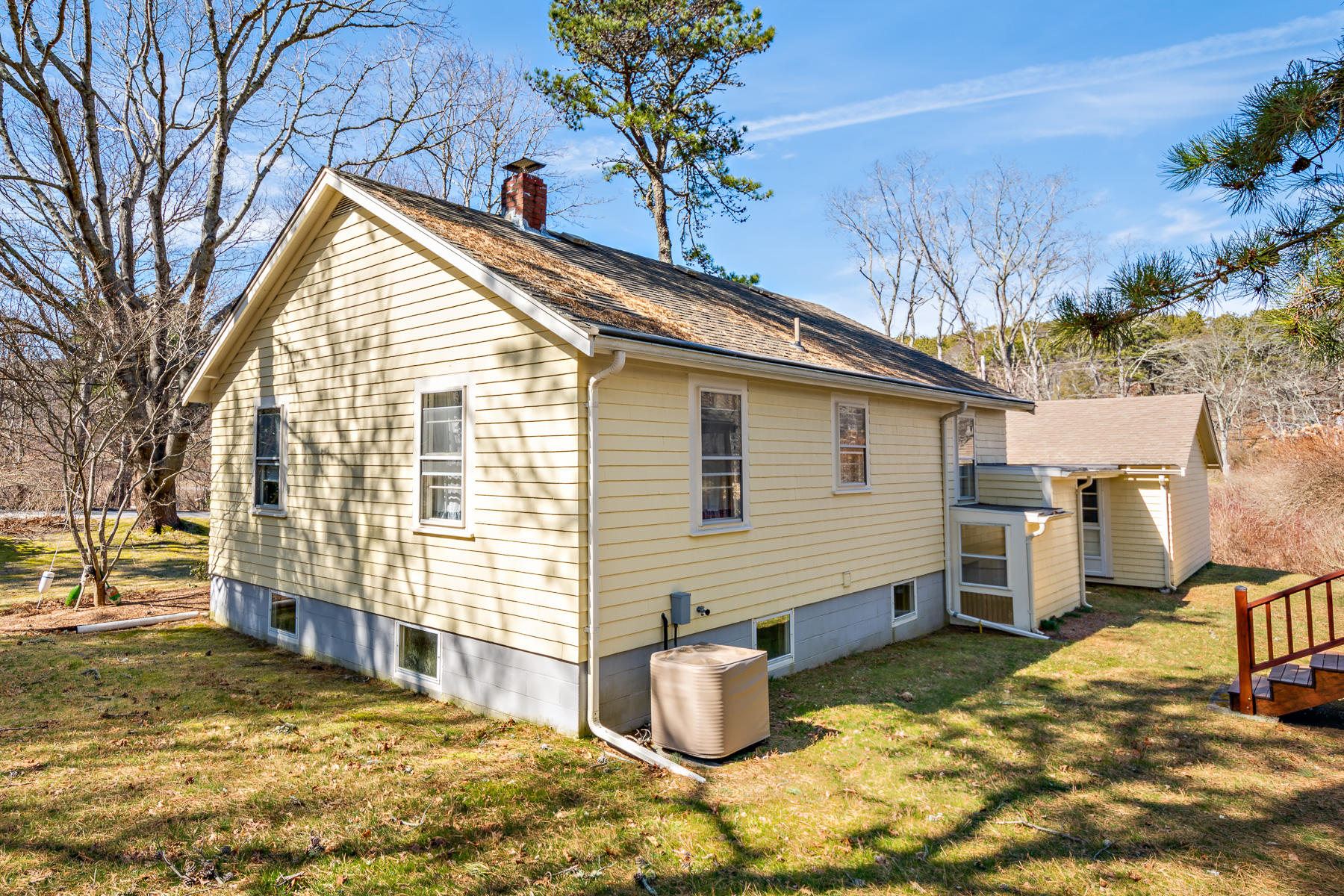 13 Atwood Road Truro, MA 02666 - Photo 4 of 36 a backyard of a house with barbeque oven table and chairs