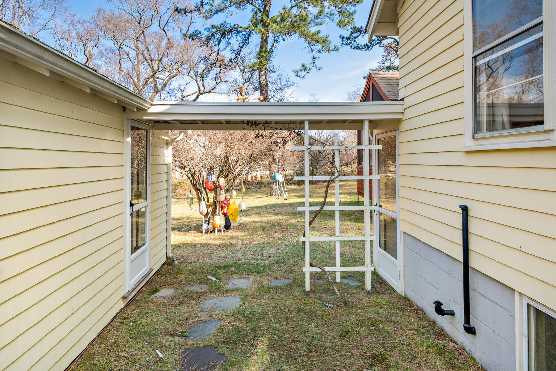 13 Atwood Road Truro, MA 02666 - Photo 10 of 36 a view of a porch with wooden floor and fence