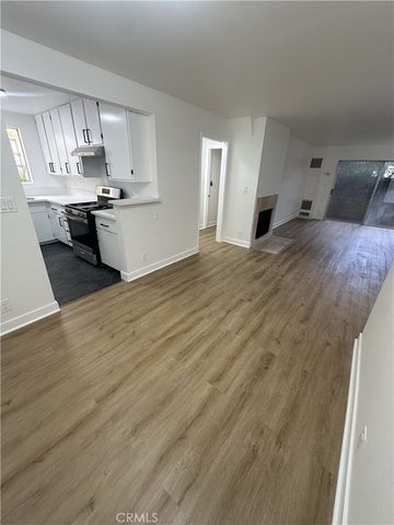 a kitchen with granite countertop a sink and cabinets