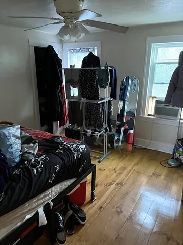 a bed room with a bed and a gym