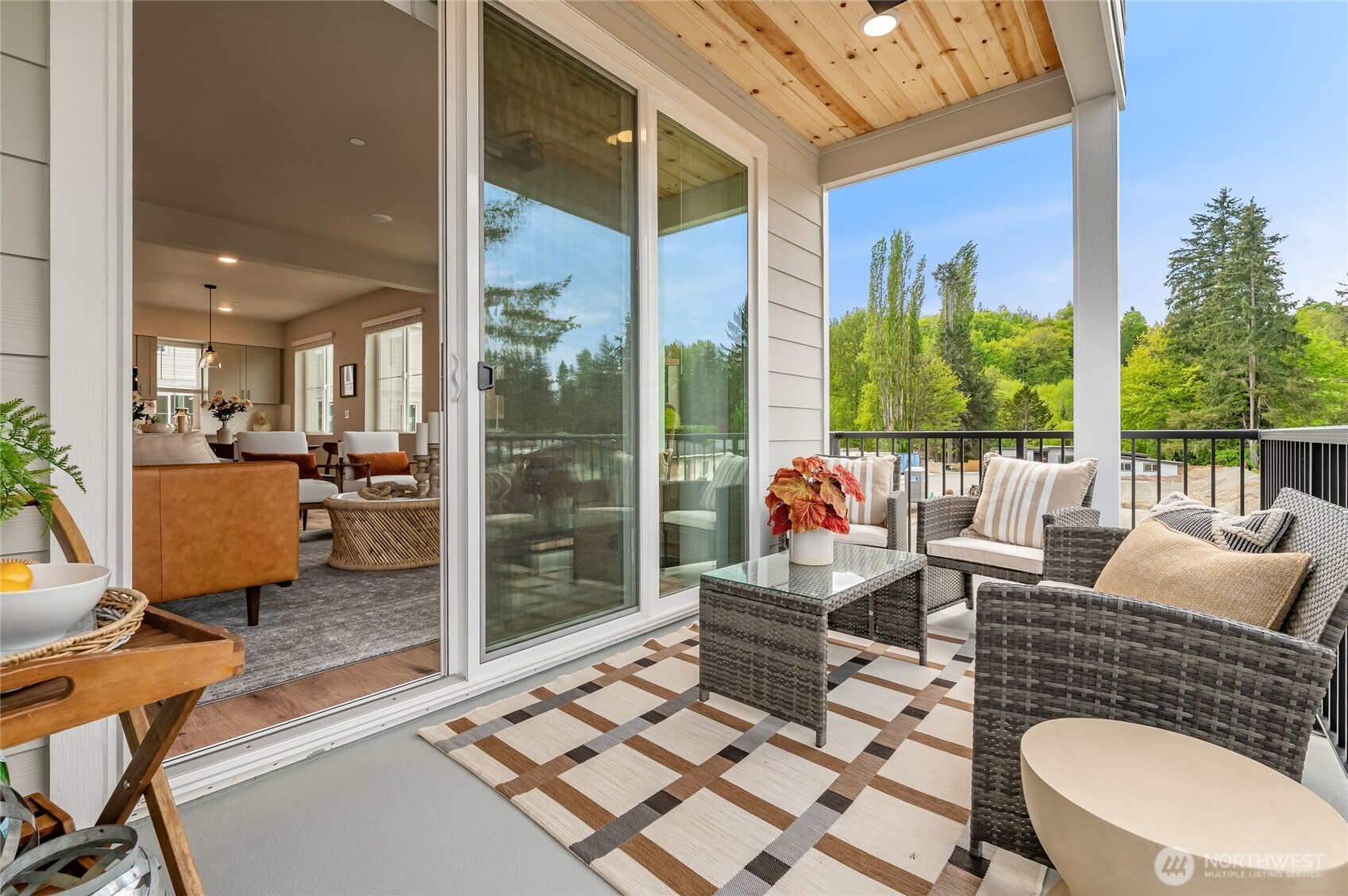 1322 194th Street Southeast, Unit B7 Bothell, WA 98012 - Photo 5 of 18 a living room with patio furniture and a floor to ceiling window