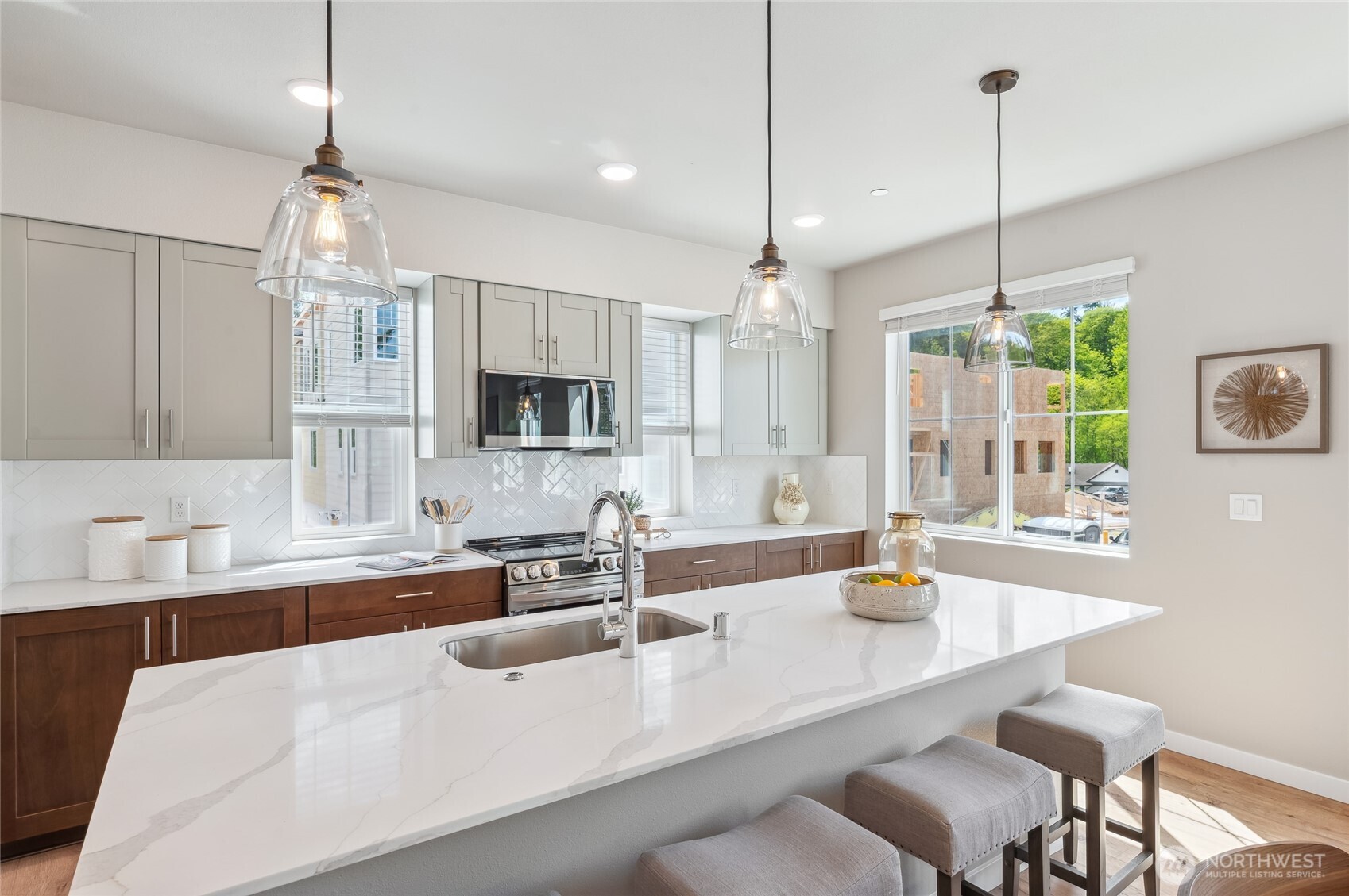 1322 194th Street Southeast, Unit B7 Bothell, WA 98012 - Photo 6 of 18 a kitchen with counter space windows and chairs