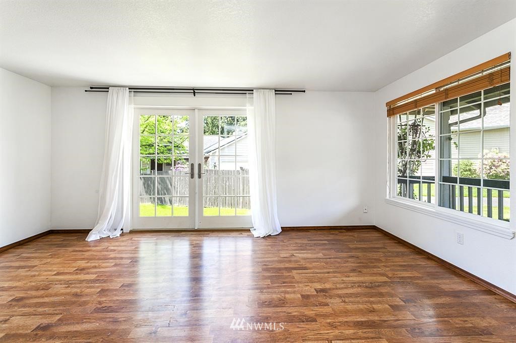 1310 233rd Place Southwest Bothell, WA 98021 - Photo 4 of 21 a view of an empty room with a window