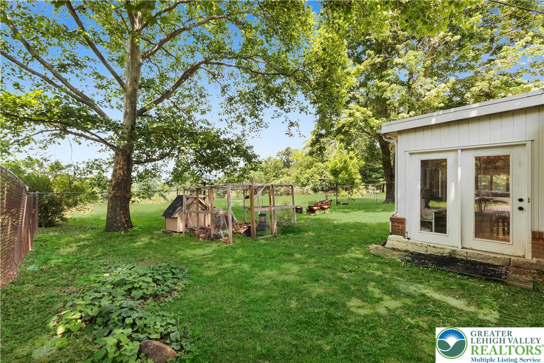 5747 Kernsville Road Orefield, PA 18069 - Photo 46 of 56 a view of a house with backyard and a tree