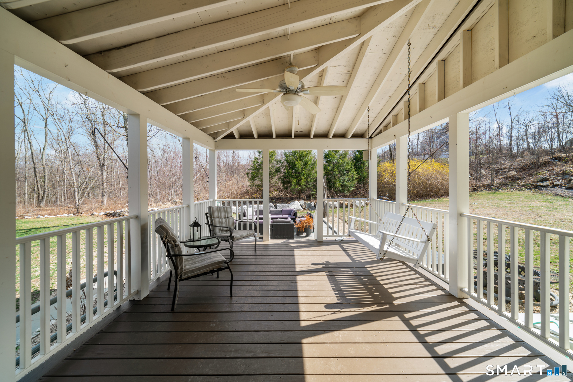 110 Sleepy Hill Road Southbury, CT 06488 - Photo 35 of 40 Full length Porch, freshly painted with nice beams and ceiling fan, overlooking the backyard