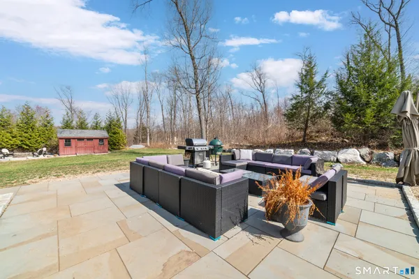a view of a patio with couches and potted plants