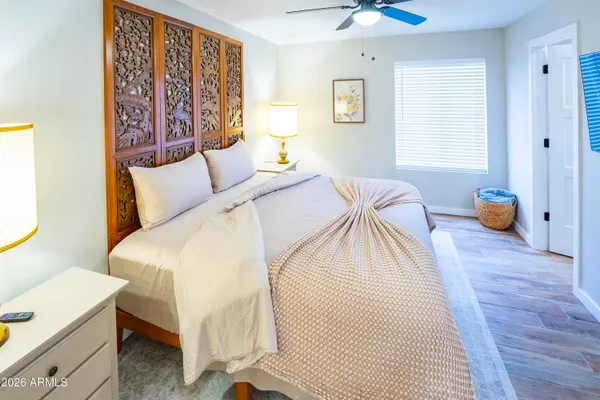 a bed room with a bed and a window