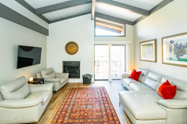 a living room with furniture and painting on the wall