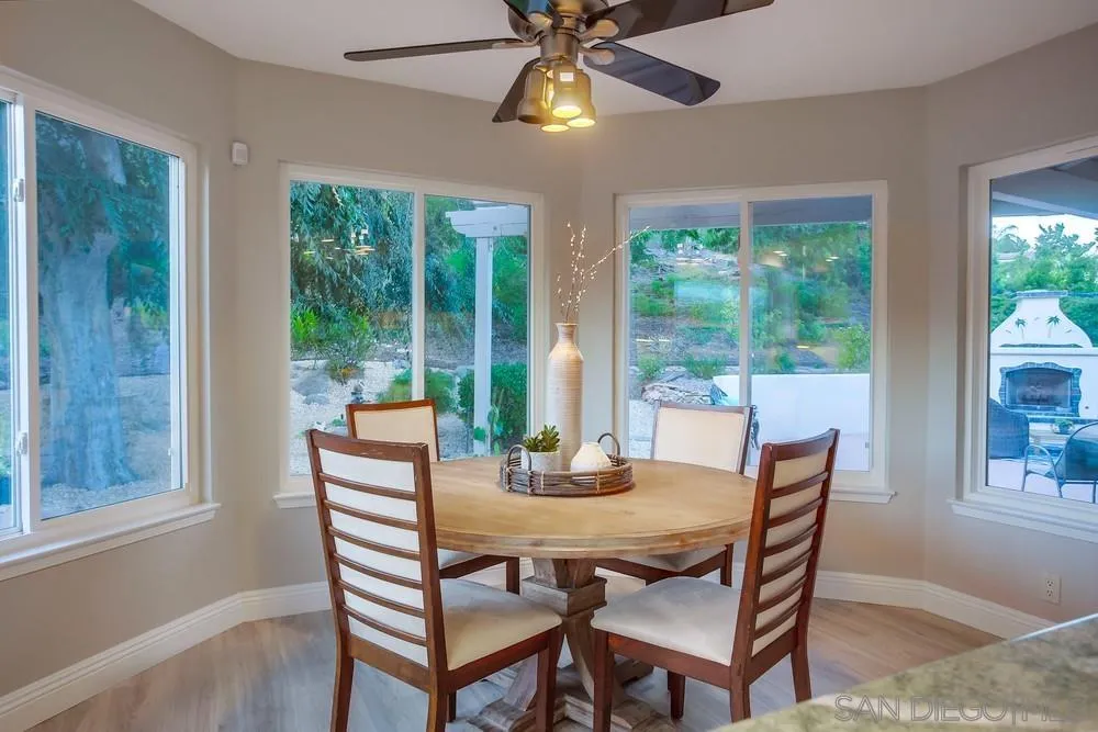 3534 Avenida Sierra Escondido, CA 92029 - Photo 11 of 38 a dining room with furniture a chandelier and wooden floor