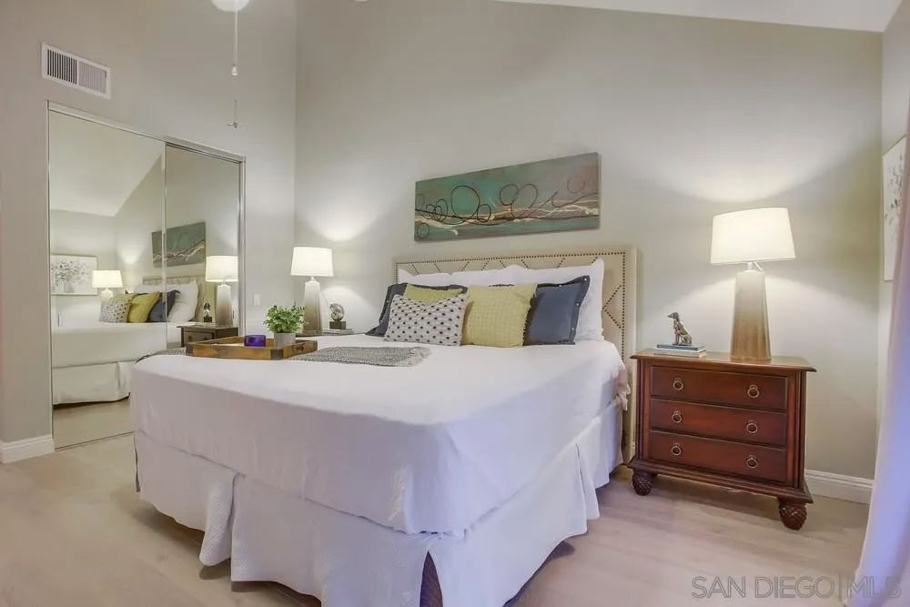 3534 Avenida Sierra Escondido, CA 92029 - Photo 17 of 38 a bedroom with a bed and a mirror