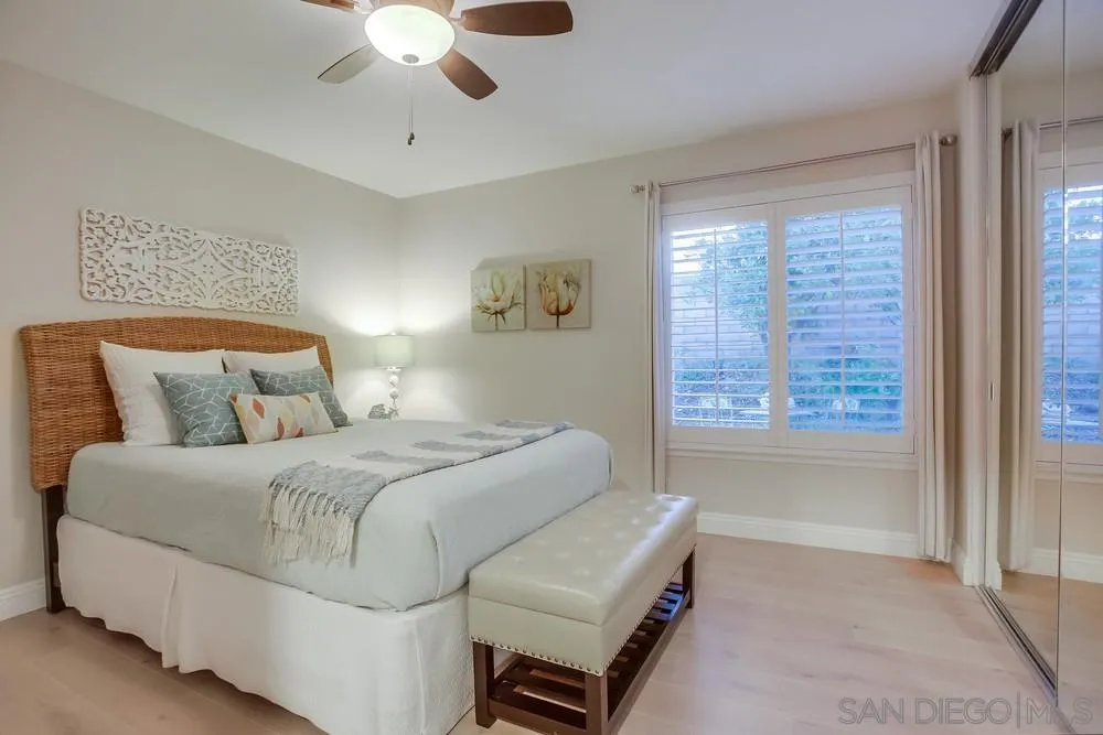 3534 Avenida Sierra Escondido, CA 92029 - Photo 22 of 38 a bedroom with a bed and a chandelier