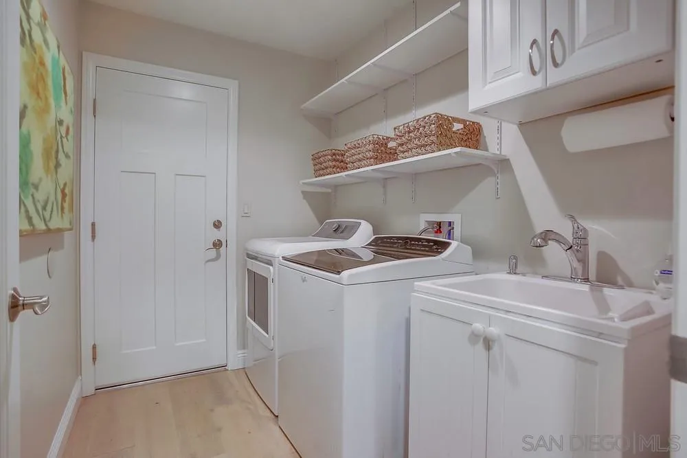 3534 Avenida Sierra Escondido, CA 92029 - Photo 25 of 38 a utility room with cabinets washer and dryer