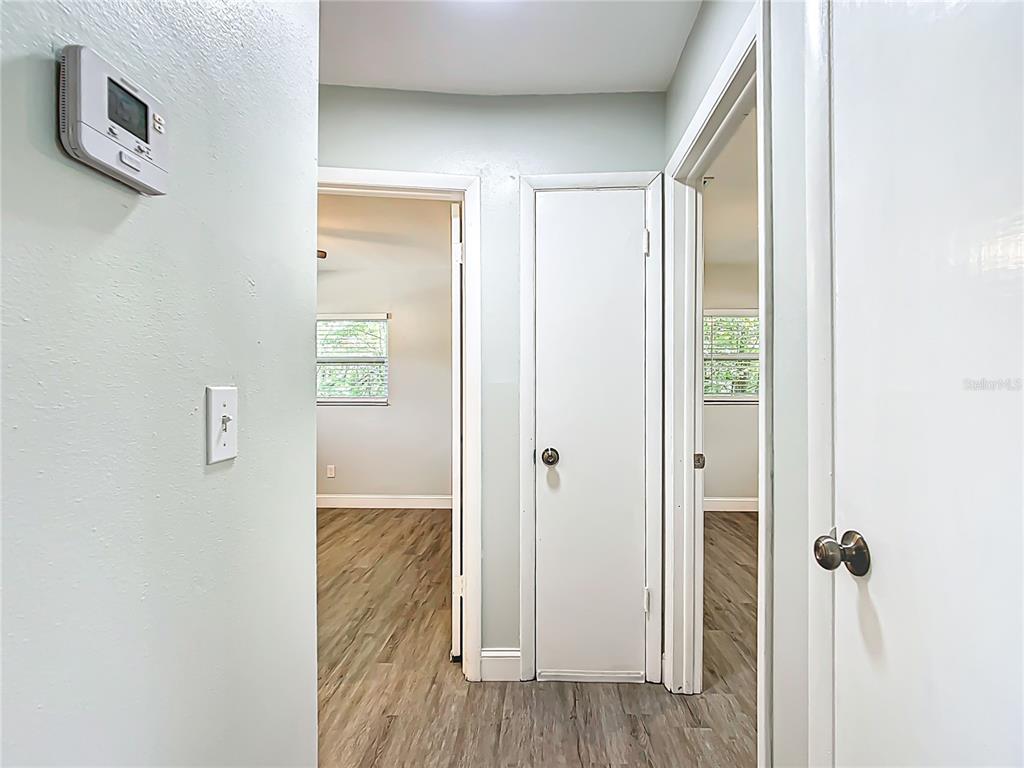 1406 Eden Drive Inverness, FL 34450 - Photo 18 of 41 a view of a hallway with wooden floor and closet