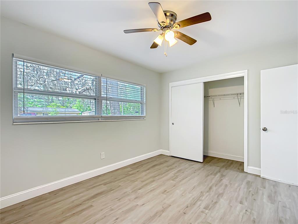 1406 Eden Drive Inverness, FL 34450 - Photo 19 of 41 wooden floor in an empty room with a window
