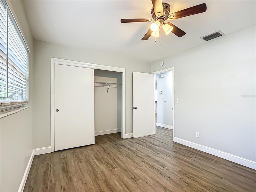 1406 Eden Drive Inverness, FL 34450 - Photo 20 of 41 wooden floor in an empty room with a window