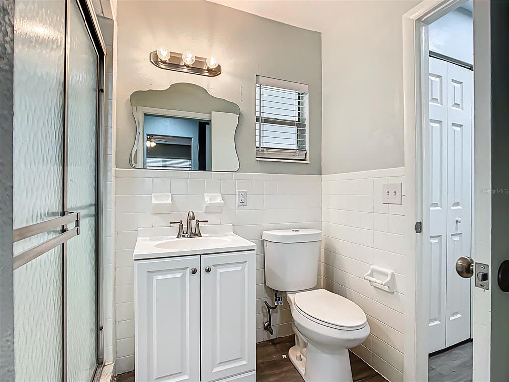1406 Eden Drive Inverness, FL 34450 - Photo 22 of 41 a bathroom with a toilet sink and mirror