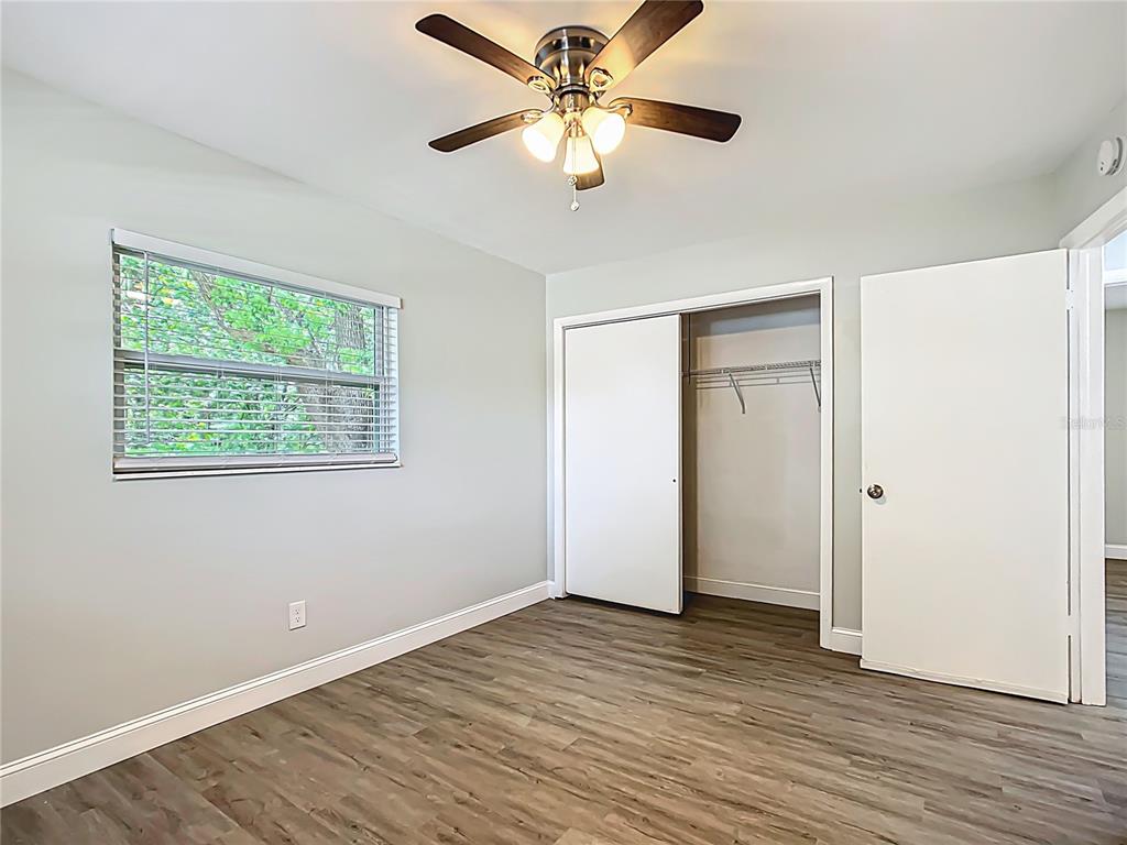 1406 Eden Drive Inverness, FL 34450 - Photo 23 of 41 a view of an empty room with wooden floor and a window