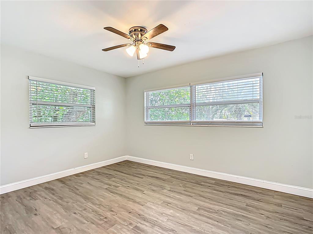 1406 Eden Drive Inverness, FL 34450 - Photo 25 of 41 a view of empty room with wooden floor and window