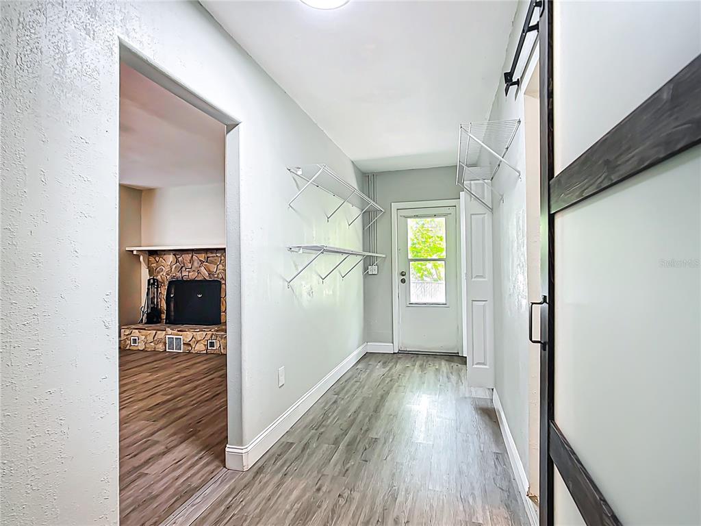 1406 Eden Drive Inverness, FL 34450 - Photo 27 of 41 a view of a hallway view with wooden floor and staircase