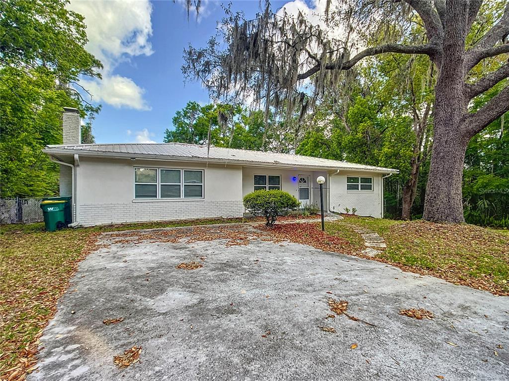 1406 Eden Drive Inverness, FL 34450 - Photo 3 of 41 front view of a house with a yard