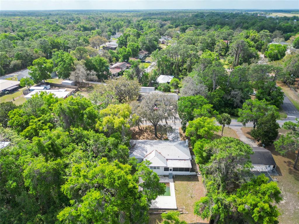 1406 Eden Drive Inverness, FL 34450 - Photo 37 of 41 an aerial view of residential house with outdoor space and trees all around