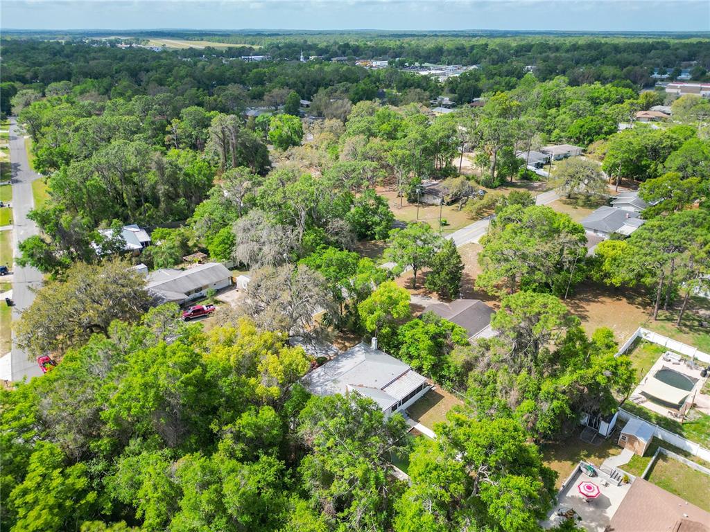 1406 Eden Drive Inverness, FL 34450 - Photo 39 of 41 an aerial view of residential house with outdoor space and trees all around