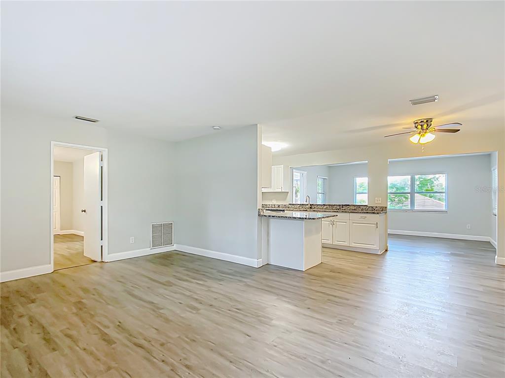 1406 Eden Drive Inverness, FL 34450 - Photo 6 of 41 a view of kitchen with granite countertop cabinets and sink