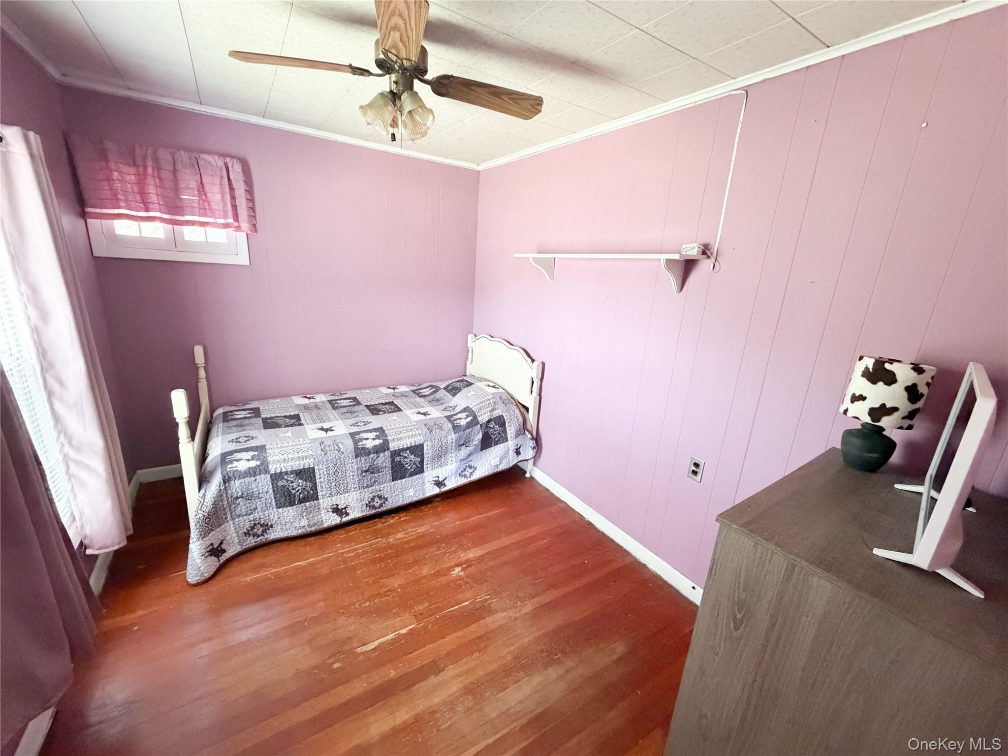 77 Rockland Road Roscoe, NY 12776 - Photo 16 of 20 Hardwood flooring and paneled walls create a distinct aesthetic