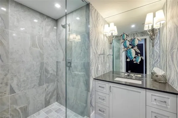 a bathroom with a shower and a sink