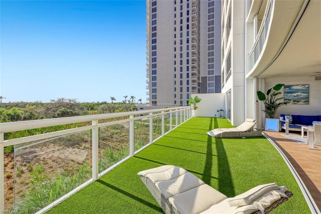 13915 Old Coast Road, Unit 305 Naples, FL 34110 - Photo 26 of 41 a view of a balcony with chairs