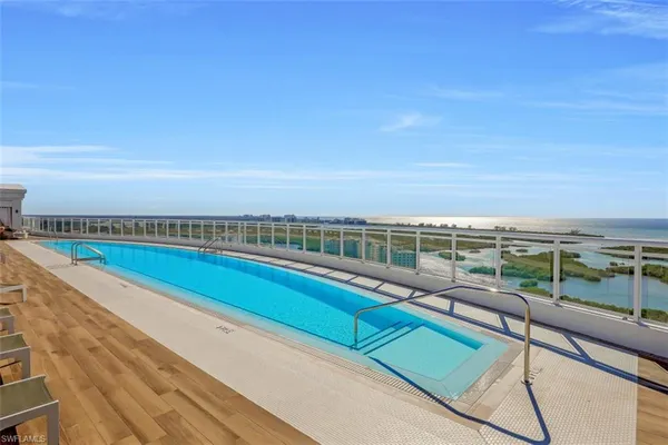 a view of a balcony with an ocean view