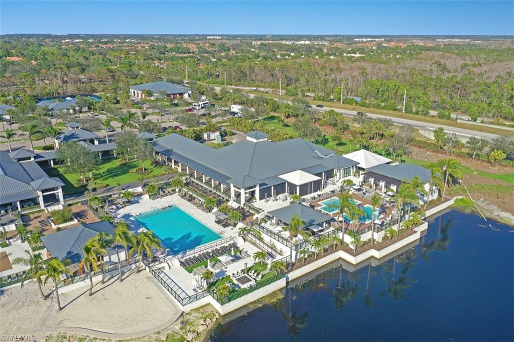 13915 Old Coast Road, Unit 305 Naples, FL 34110 - Photo 31 of 41 an aerial view of residential building with outdoor space and seating