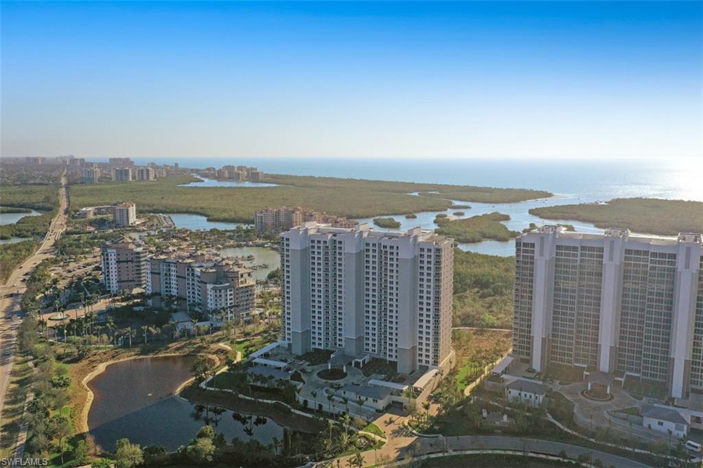 13915 Old Coast Road, Unit 305 Naples, FL 34110 - Photo 38 of 41 a view of a city with tall buildings