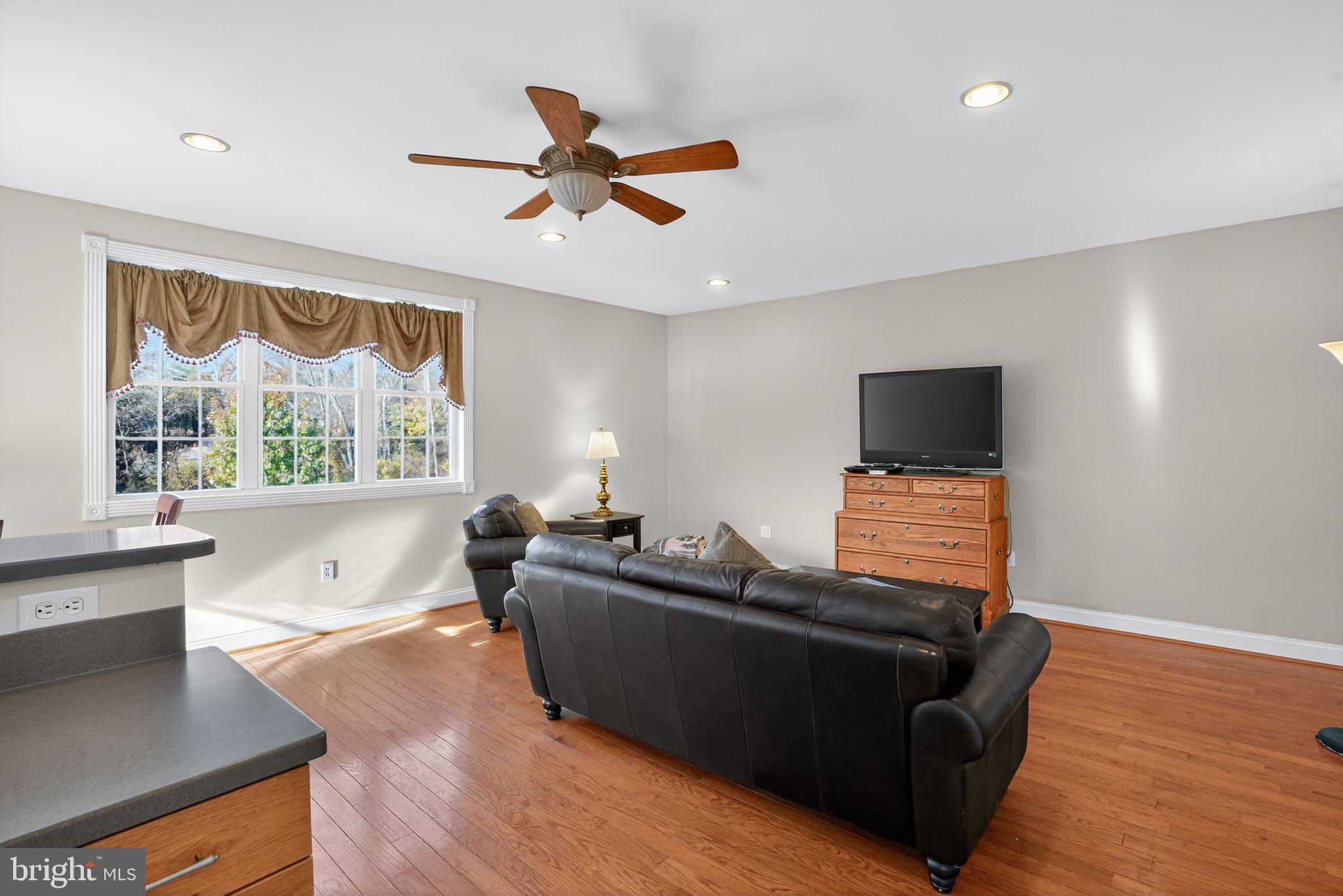 9260 Old Scaggsville Road Laurel, MD 20723 - Photo 18 of 48 a living room with furniture and a flat screen tv